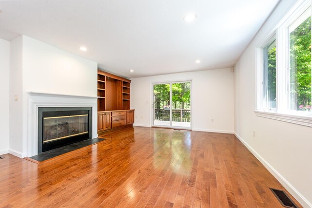 9 Longwood Rd, Mashpee, MA 02649 - unfurnished room featuring a chandelier, hardwood / wood-style floors, lofted ceiling, and baseboards