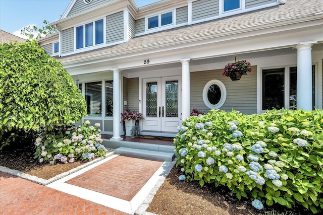 doorway to property with french doors and a porch