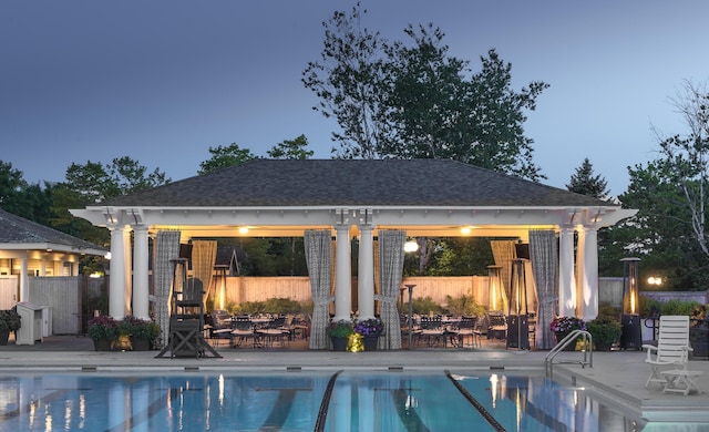 view of swimming pool with a patio area, a gazebo, fence, and a fenced in pool