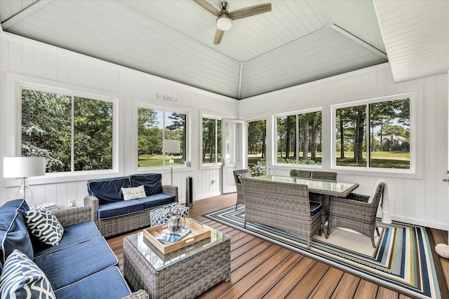 sunroom / solarium featuring outdoor lounge area, a healthy amount of sunlight, and a ceiling fan