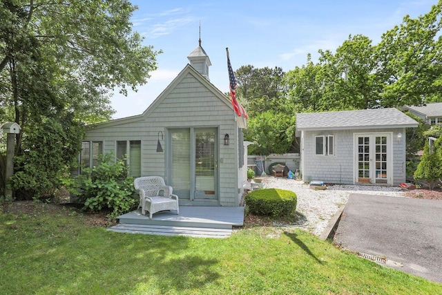 130 Wimbledon Dr, West Yarmouth, MA 02673 - back of house featuring a yard and an outdoor structure