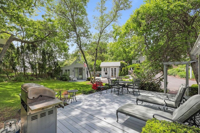 130 Wimbledon Dr, West Yarmouth, MA 02673 - deck featuring grilling area, a yard, an outbuilding, outdoor dining area, and french doors