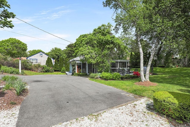 130 Wimbledon Dr, West Yarmouth, MA 02673 - view of front of home with a front lawn and asphalt driveway