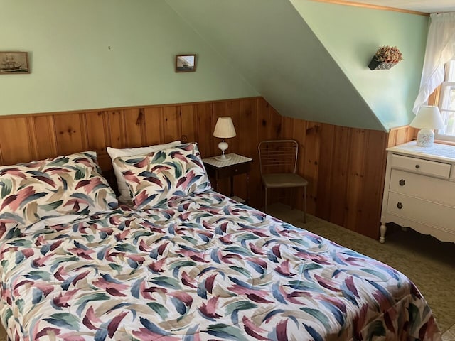 131 Forest Beach Rd, South Chatham, MA 02659 - carpeted bedroom with wood walls, lofted ceiling, and wainscoting