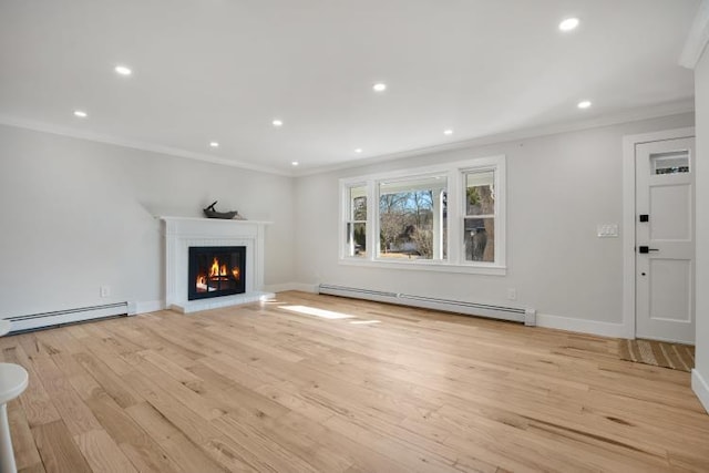 unfurnished living room with ornamental molding, a warm lit fireplace, light wood-type flooring, and a baseboard radiator