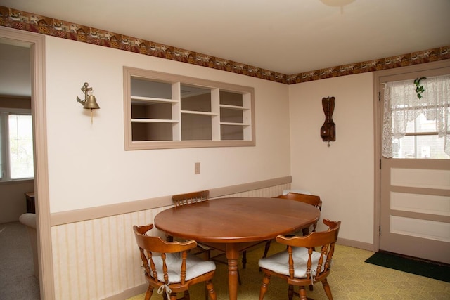 dining room featuring light floors and plenty of natural light