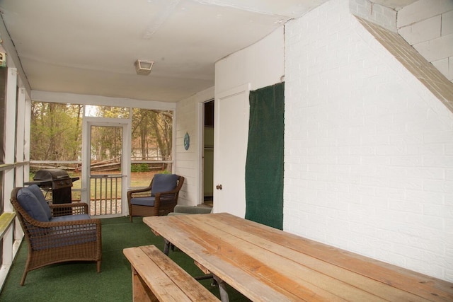 sunroom / solarium featuring outdoor lounge area