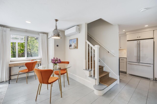 143R Bradford Street Ext Unit 2, Provincetown, MA 02657 - dining space with an AC wall unit, stairs, recessed lighting, and baseboards