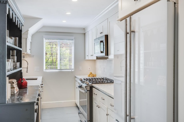 143R Bradford Street Ext Unit 2, Provincetown, MA 02657 - kitchen featuring appliances with stainless steel finishes, baseboards, recessed lighting, a sink, and white cabinetry