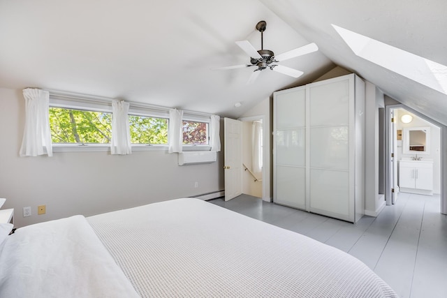 143R Bradford Street Ext Unit 2, Provincetown, MA 02657 - bedroom featuring a skylight, a baseboard heating unit, lofted ceiling, ceiling fan, and a closet