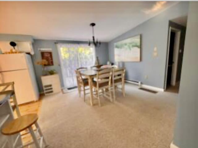4 Coffey Ln, Dennis Port, MA 02639 - dining space featuring lofted ceiling and light colored carpet