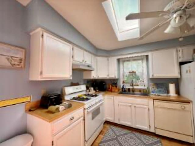 4 Coffey Ln, Dennis Port, MA 02639 - kitchen featuring white appliances, under cabinet range hood, ceiling fan, and light countertops