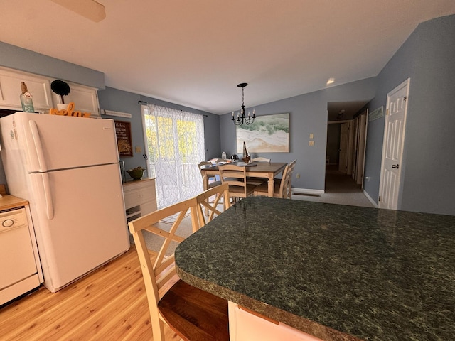 4 Coffey Ln, Dennis Port, MA 02639 - dining area with light wood-style floors, a chandelier, and lofted ceiling