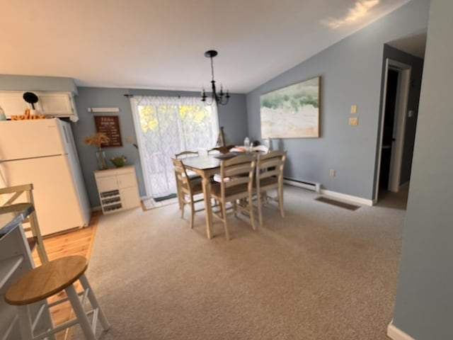 4 Coffey Ln, Dennis Port, MA 02639 - dining space with a chandelier, light carpet, a baseboard heating unit, and lofted ceiling