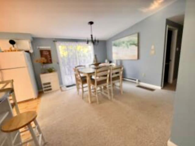 4 Coffey Ln, Dennis Port, MA 02639 - dining room featuring vaulted ceiling, carpet floors, and baseboard heating