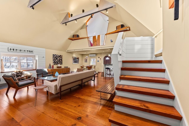 2 Daggett Ln, Provincetown, MA 02657 - living room with wood-type flooring and high vaulted ceiling