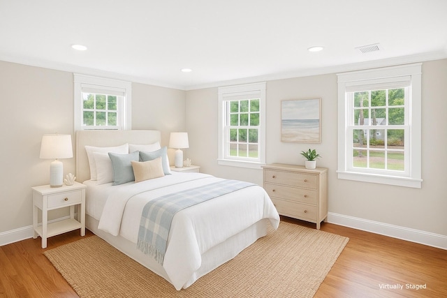 28 Stoney Cliff Rd, Centerville, MA 02632 - bedroom featuring light wood-type flooring, multiple windows, recessed lighting, and crown molding