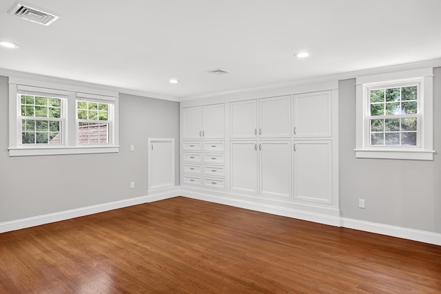 28 Stoney Cliff Rd, Centerville, MA 02632 - unfurnished bedroom with dark wood-type flooring, crown molding, and recessed lighting