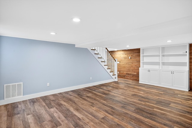 28 Stoney Cliff Rd, Centerville, MA 02632 - finished basement with stairs, dark wood finished floors, recessed lighting, and wooden walls