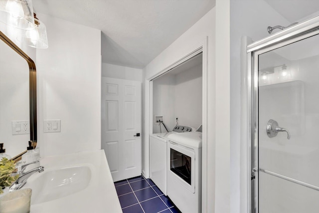 13 Pickerel Way, Forestdale, MA 02644 - bathroom with tile patterned floors, a stall shower, vanity, and washer and clothes dryer