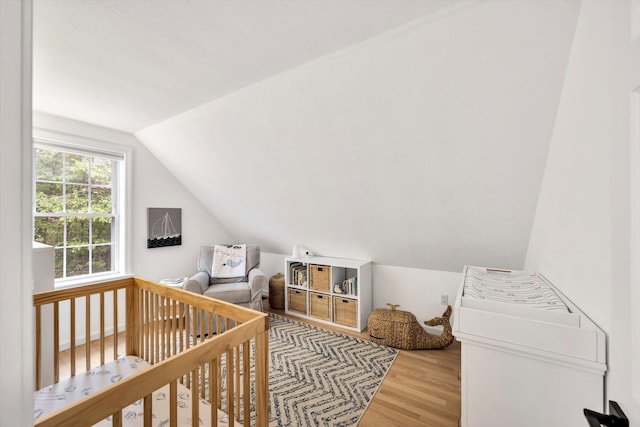 13 Pickerel Way, Forestdale, MA 02644 - bedroom with lofted ceiling, wood finished floors, and a nursery area