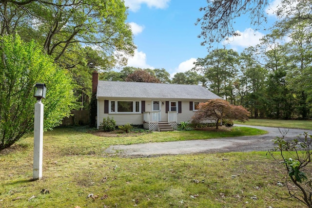 ranch-style house with a front yard