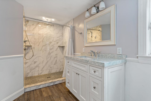 bathroom featuring hardwood / wood-style floors, curtained shower, and vanity