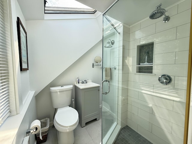 9 Kens Way W, Yarmouth, MA 02673 - bathroom with a stall shower, vanity, tile patterned flooring, and a skylight