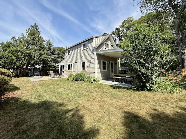 9 Kens Way W, Yarmouth, MA 02673 - rear view of property with a patio and a carport