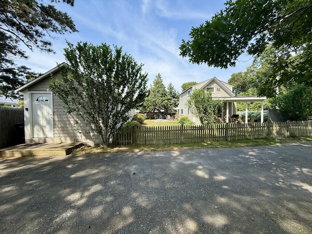 9 Kens Way W, Yarmouth, MA 02673 - view of side of home featuring a fenced front yard