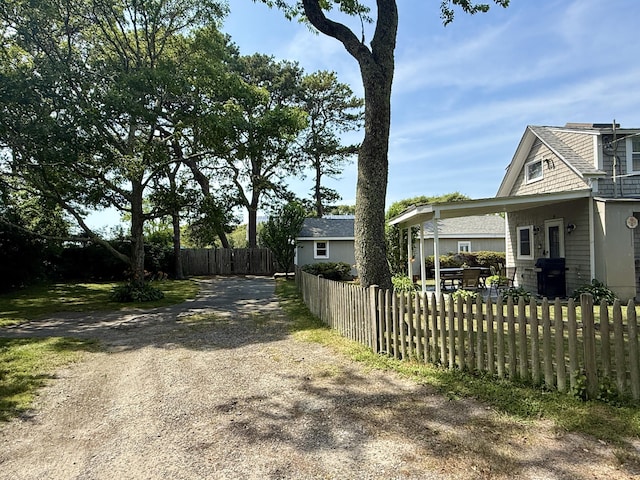 9 Kens Way W, Yarmouth, MA 02673 - view of property exterior featuring dirt driveway