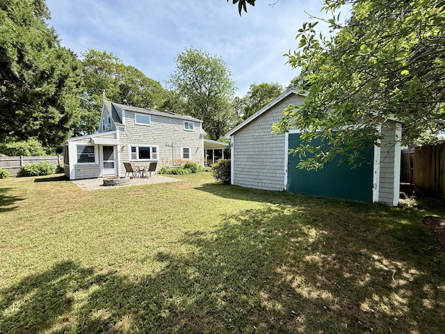 9 Kens Way W, Yarmouth, MA 02673 - back of house with an outdoor structure and a patio area