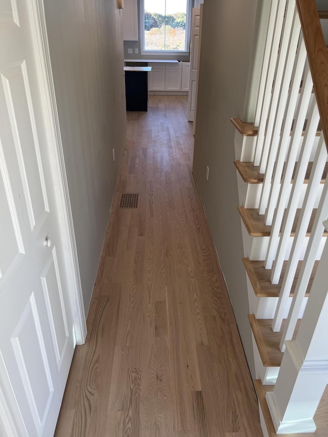 hallway featuring light hardwood / wood-style floors