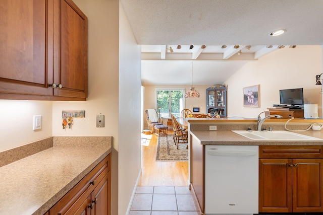 248 Kates Path, Yarmouth Port, MA 02675 - kitchen with dishwasher, brown cabinets, and beamed ceiling