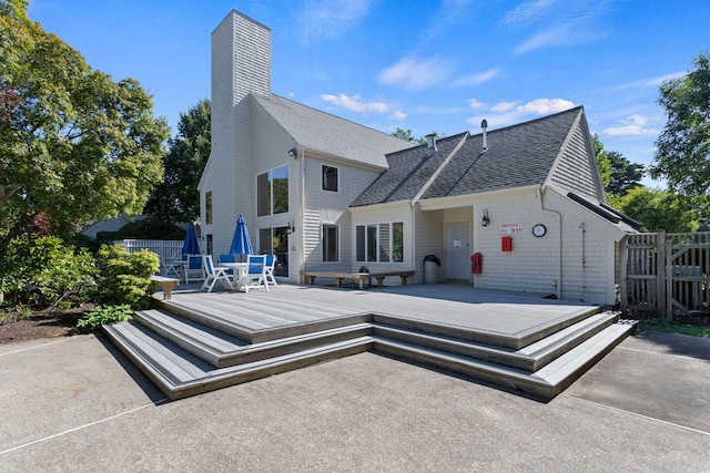 248 Kates Path, Yarmouth Port, MA 02675 - back of house featuring a shingled roof, a wooden deck, and a chimney