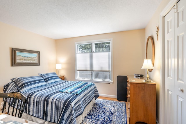 248 Kates Path, Yarmouth Port, MA 02675 - bedroom featuring wood finished floors and a textured ceiling