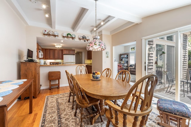248 Kates Path, Yarmouth Port, MA 02675 - dining room with healthy amount of natural light, beamed ceiling, and light wood-type flooring