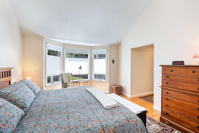 248 Kates Path, Yarmouth Port, MA 02675 - bedroom featuring light wood-type flooring and vaulted ceiling