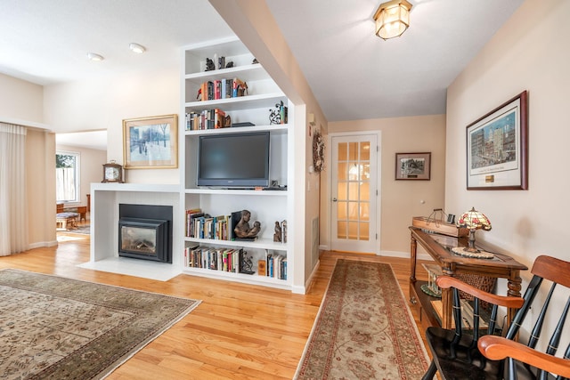248 Kates Path, Yarmouth Port, MA 02675 - entrance foyer with wood finished floors and a fireplace with flush hearth