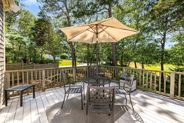 248 Kates Path, Yarmouth Port, MA 02675 - deck with outdoor dining space and view of scattered trees