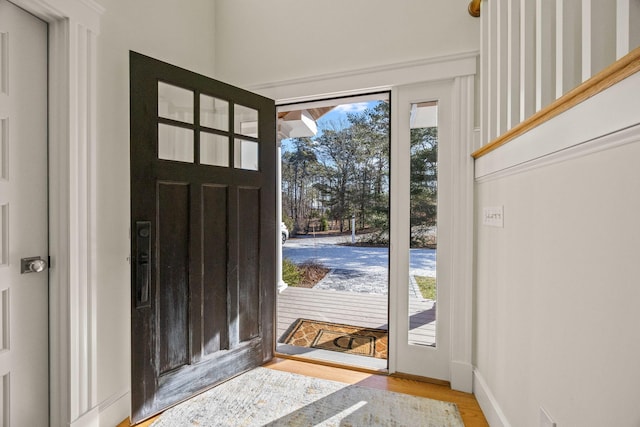 entryway with light hardwood / wood-style floors