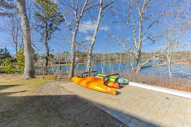 view of patio with a water view