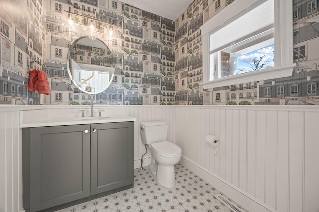 bathroom featuring vanity and toilet