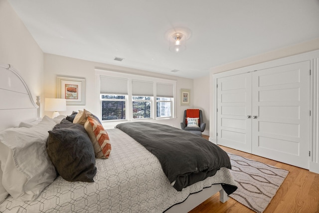 bedroom featuring light hardwood / wood-style floors and a closet