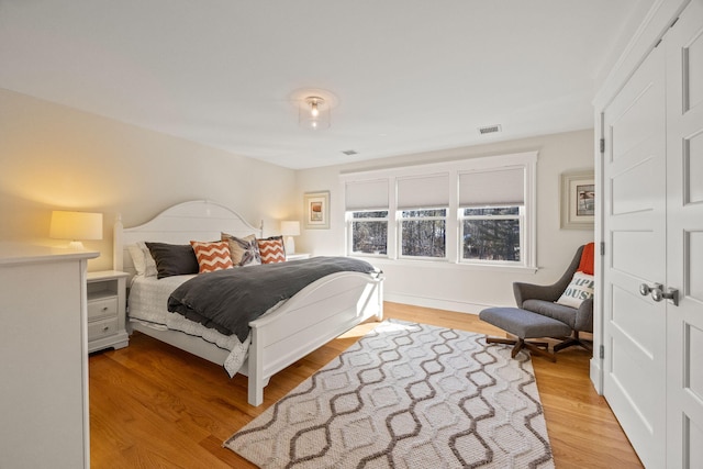 bedroom with light hardwood / wood-style floors