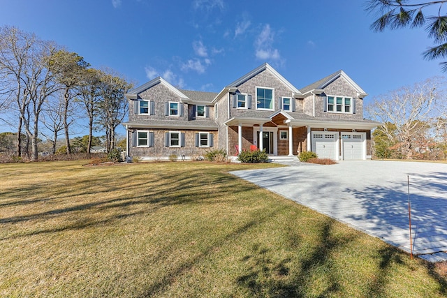 view of front facade featuring a garage and a front lawn