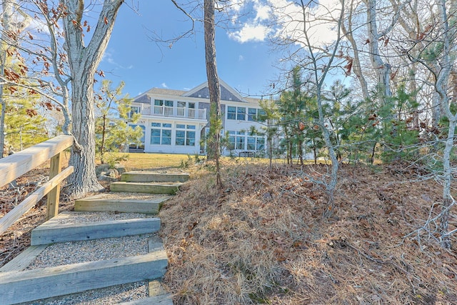 rear view of property with a balcony