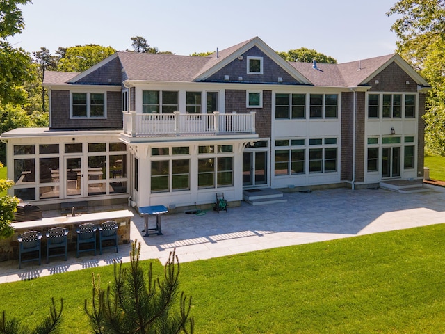 20 Chase St, West Harwich, MA 02671 - back of property with a balcony, a patio area, entry steps, and a yard