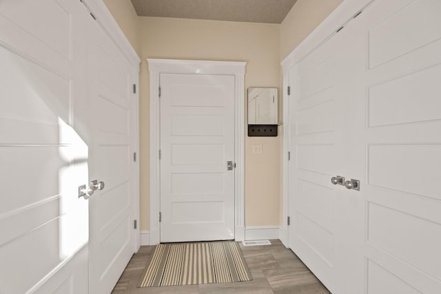 corridor with dark wood-type flooring