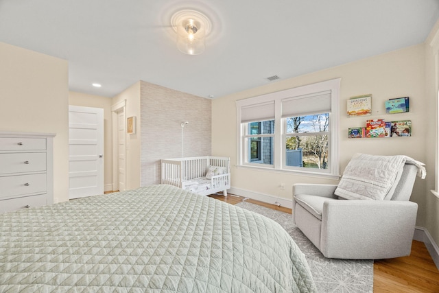 bedroom with light hardwood / wood-style floors